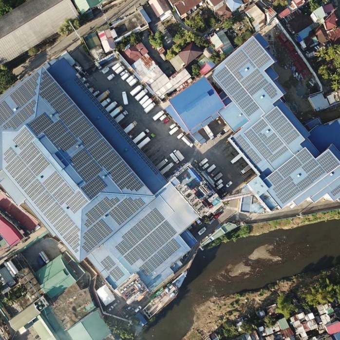 aerial view of solar panels on top of a building