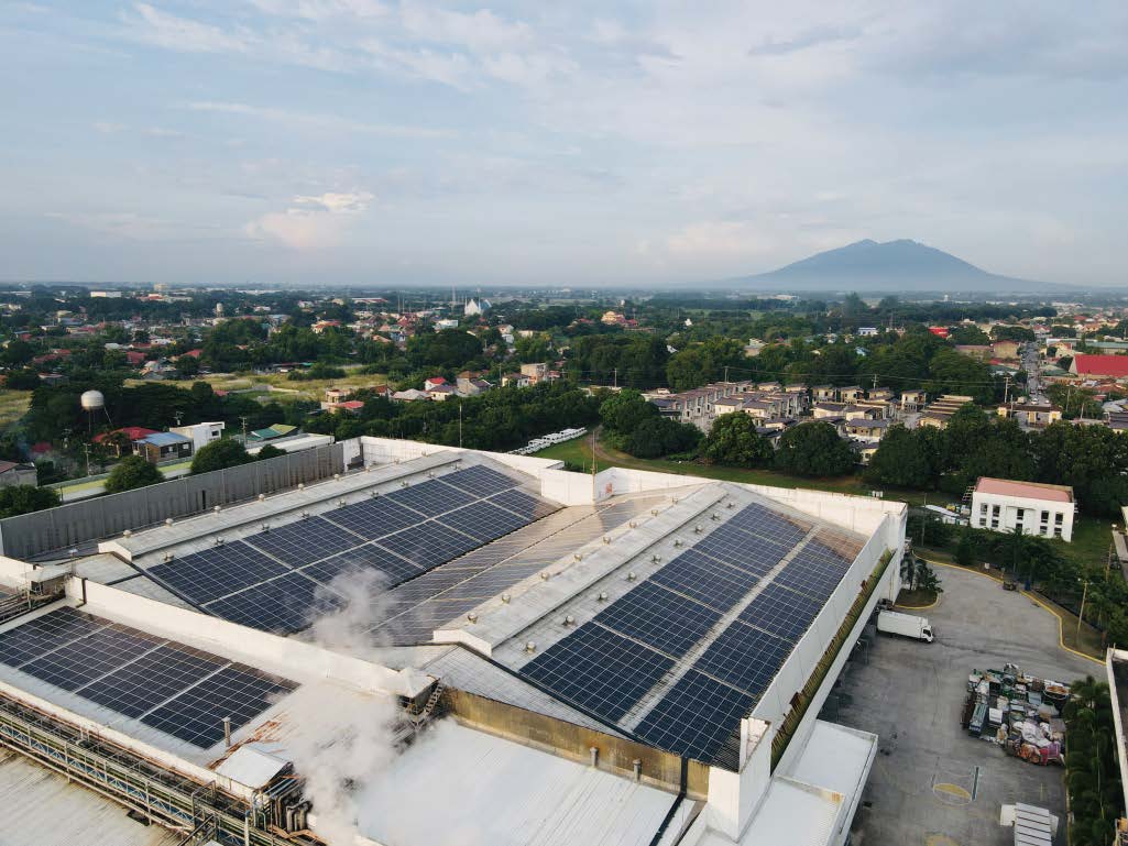 aerial view of solar panels on top of a building